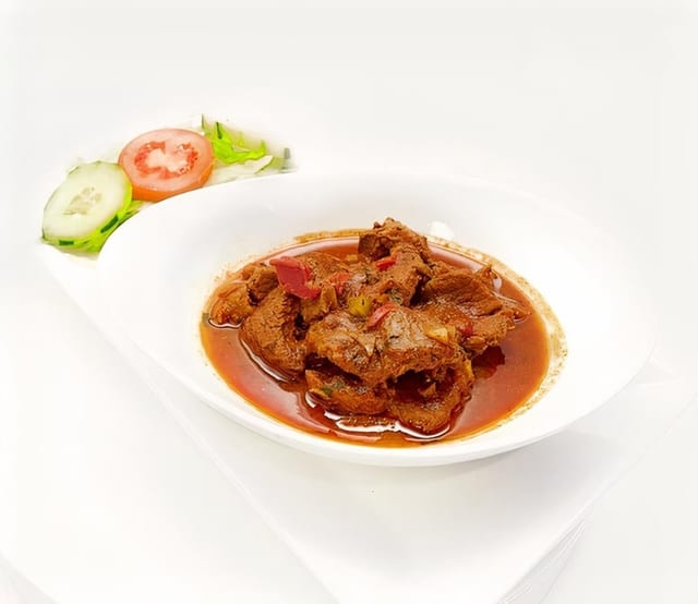 Pollo Guisado.